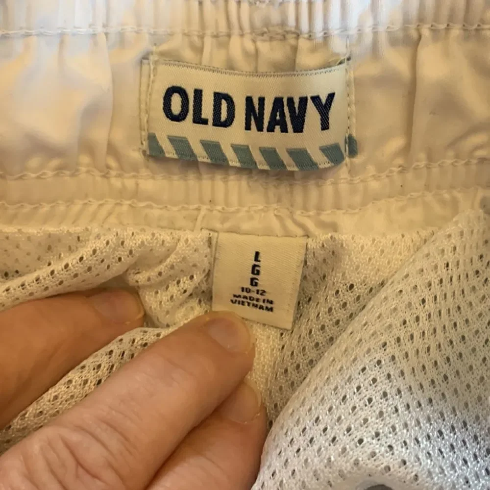 3/$30 Old Navy navy and white boys swim trunks with pockets. Size L( 10-12 )